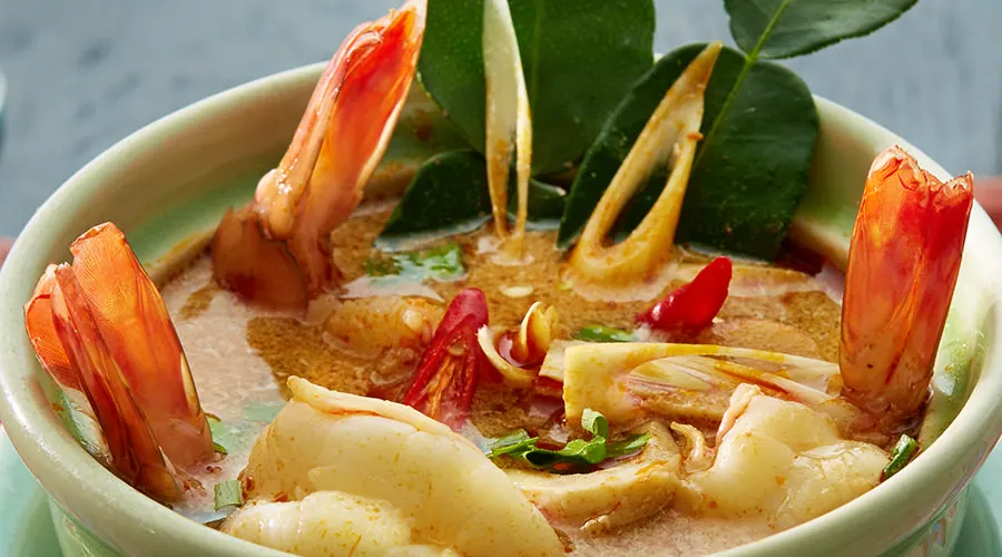 Plated Thai dish with carved vegetable garnish